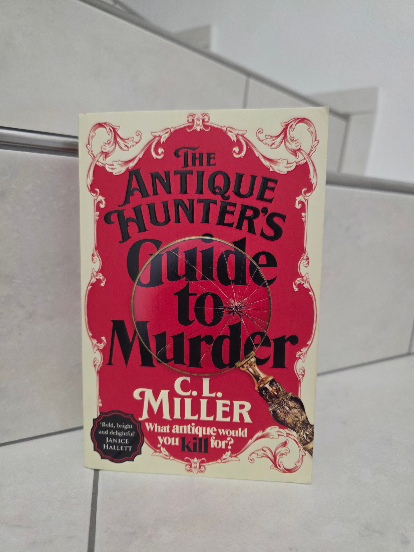 The Antique Hunter's Guide to Murder by C.L. Miller