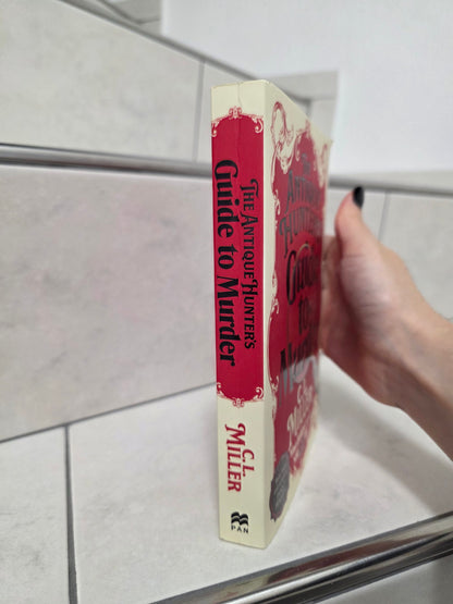 The Antique Hunter's Guide to Murder by C.L. Miller