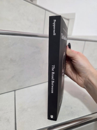 The Road Between by Courtney Peppernell