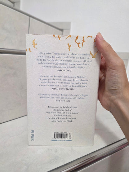 Die Farbe von Glück: Ein Roman über das Ankommen von Clara Maria Bagus